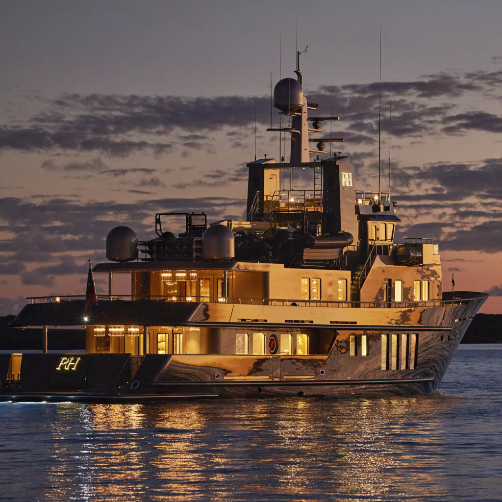 RH-branded exploration yacht cruising at dusk, reflecting RH's expansion into luxury hospitality