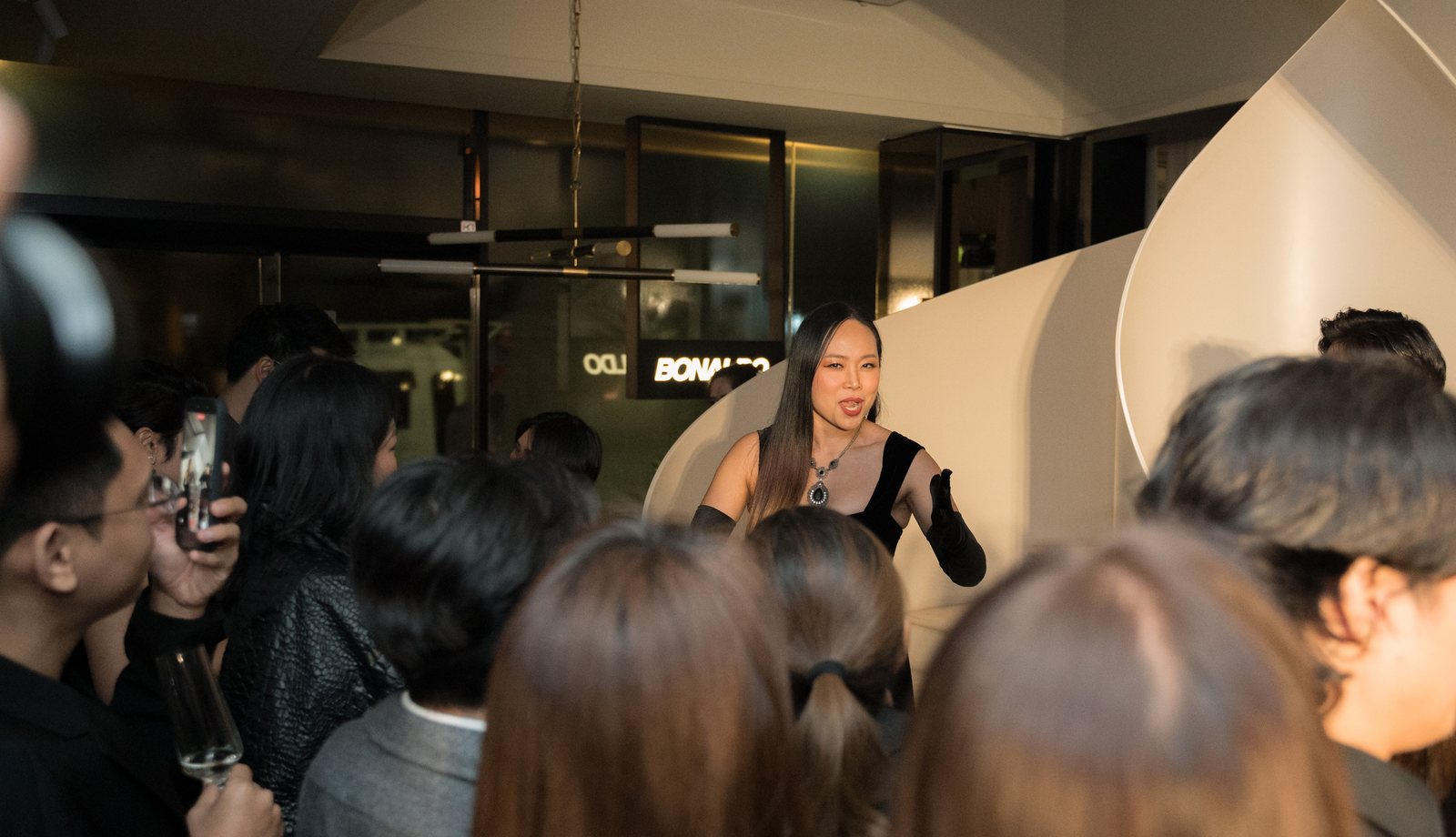 Dr. Fueanglada Prawang Carlson singing Italian-style opera to guests at The Legacy of Motion, Bonaldo Space by OL Atelier, Bangkok